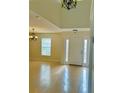 Bright foyer with tile floors and a view of the front door at 2403 Melissa Ann Ct, Kissimmee, FL 34746