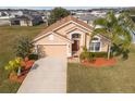 Attractive single-Gathering home with a two-car garage and manicured lawn at 2542 Bobby Lee Ln, St Cloud, FL 34772