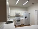 Modern kitchen with white cabinets and a breakfast bar at 3133 Sun Lake Ct # B, Kissimmee, FL 34747