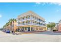 Three-story building with balconies and ground floor retail at 600 Market St # 210, Celebration, FL 34747
