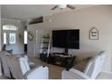 Cozy living room features comfortable seating, a modern entertainment center, and neutral tones at 6002 Renaissance Ct, St Cloud, FL 34772