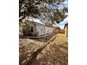 Gray house with a side yard and walkway at 656 Oakford Way, Orlando, FL 32811