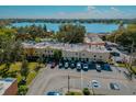 Scenic aerial shot of lakeside residences showcasing parking, landscaping, and community charm at 768 E Michigan St # 75, Orlando, FL 32806