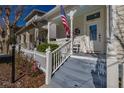 Inviting front porch with rocking chairs and white railings at 836 Lake Evalyn Dr, Celebration, FL 34747