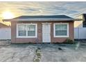 Cute single story home with a pink exterior and white accents at 1109 5Th Sw St, Winter Haven, FL 33880