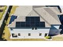 Aerial view of a roof fitted with solar panels at 15079 Willow Arbor Cir, Orlando, FL 32824