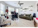 Home office with desk, seating, and guitar at 17863 Passionflower Cir, Clermont, FL 34714