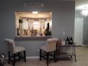 View of kitchen and breakfast area from living room at 180 Daigledog St, St Cloud, FL 34772