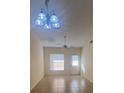 Bright living room with a ceiling fan and door that leads to an outdoor space at 1919 Bentley Blvd, Kissimmee, FL 34741