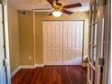 Spacious bedroom with hardwood floors and double door closet at 2007 Dixie Belle Dr # 2007 I, Orlando, FL 32812