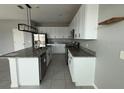 Modern kitchen featuring granite countertops and stainless steel appliances at 231 Tarpon Bay Blvd, Haines City, FL 33844