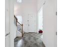 Bright entryway with tile flooring and staircase at 2821 Rialto Ct, Kissimmee, FL 34746