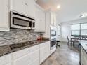 Sleek kitchen with granite countertops and stainless steel appliances at 2821 Rialto Ct, Kissimmee, FL 34746