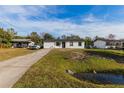 Newly renovated home with a white exterior and black accents at 2959 Old Dixie Hwy, Kissimmee, FL 34744