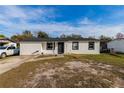Newly renovated home with a white exterior and black accents at 2959 Old Dixie Hwy, Kissimmee, FL 34744