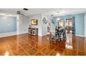 Open dining area with tile floors and modern table at 508 Bar Dr, Kissimmee, FL 34759