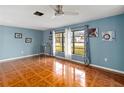 Living room featuring tile floors and large windows at 508 Bar Dr, Kissimmee, FL 34759