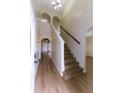 Bright entryway with staircase and wood-look floors at 945 Gateshead Ct, Kissimmee, FL 34758