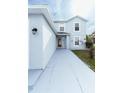 Light blue house with walkway leading to front entrance at 945 Gateshead Ct, Kissimmee, FL 34758