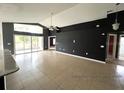 Bright and airy living room with sliding glass doors leading to the patio at 1005 Tequesta Trl, Lake Wales, FL 33898