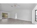 Spacious living area with high ceilings and sliding glass doors at 10420 Vista Del Sol Cir, Clermont, FL 34711