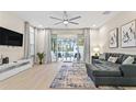 Spacious living room with sliding doors opening to a pool area at 17354 Blessing Dr, Clermont, FL 34714