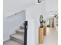 Bright entryway with stairs, console table, and mirror at 1791 Yellow Trl, Lakeland, FL 33801
