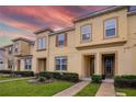 Charming townhouse with lush landscaping and a well-maintained front yard at 2186 Fleming Mist Pl, Kissimmee, FL 34747