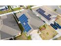 Aerial view of home showing roof with solar panels and manicured lawn at 264 Citrus Pointe Dr, Haines City, FL 33844