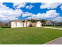 Two-story house with a large yard and driveway at 2715 Rismen Ct, Kissimmee, FL 34743