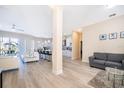 Open concept living room and kitchen with hardwood floors at 2715 Rismen Ct, Kissimmee, FL 34743