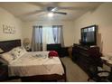 Spacious bedroom with a king-size bed and plenty of closet space at 3181 Serendipity Way, Davenport, FL 33896