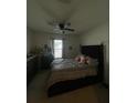 Comfortable bedroom with a king-size bed and large window at 3181 Serendipity Way, Davenport, FL 33896