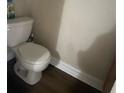 Small bathroom with white toilet and vinyl flooring at 428 Sand Lime Rd, Winter Garden, FL 34787