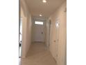 Bright entryway with tile flooring and neutral-colored walls at 522 Noble Ave, Davenport, FL 33837