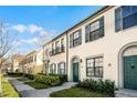 Townhouse exterior showcasing architectural details and landscaping at 709 Centervale Dr, Celebration, FL 34747