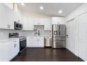 Modern kitchen featuring stainless steel appliances and white cabinets at 827 Albi Ct, Kissimmee, FL 34759