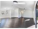 Spacious living room with dark floors and recessed lighting at 827 Albi Ct, Kissimmee, FL 34759