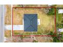 Aerial view showing a single story home with gray roof and a large backyard at 937 Elkcam Blvd, Deltona, FL 32725