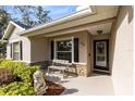Inviting front porch with bench seating and decorative lion statue at 1150 Eden Dr, St Cloud, FL 34771