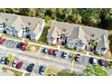 Complex of condo buildings from above, showing parking and surroundings at 2035 Royal Bay Blvd # 45, Kissimmee, FL 34746