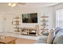 Bright living room with comfy seating and entertainment center at 2035 Royal Bay Blvd # 45, Kissimmee, FL 34746