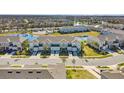 Wide aerial view of the townhome community and surrounding landscape at 2106 Crystal Bell St, Orlando, FL 32824