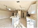 Modern kitchen with white cabinets and quartz countertops at 248 Lindale St, Lakeland, FL 33809