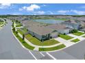 Aerial view of a neighborhood with a pond showing the home's prime location within the community at 401 Chayne Pl, St Cloud, FL 34771