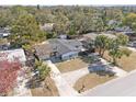 An aerial view of a single-story home, showcasing its simple design and peaceful, tree-lined surroundings at 45 S Edgemon Ave, Winter Springs, FL 32708