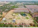 Aerial view showing property boundaries and structures on a large lot at 4771 Deen Still Rd, Polk City, FL 33868