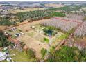 Aerial view highlighting property lines and various structures on the land at 4771 Deen Still Rd, Polk City, FL 33868