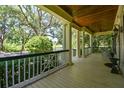 Large front porch offering scenic views of the surrounding landscape at 510 Golfpark Dr, Celebration, FL 34747