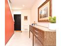 Bright entryway with console table and staircase at 1239 Berry Ln, Davenport, FL 33837